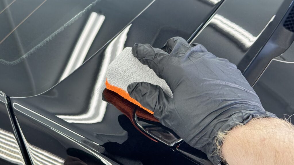A ceramic coating applicator being used